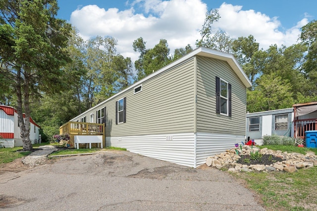 217 Mayfair Rd, Vadnais Heights, MN 55127 - view of property exterior with a deck