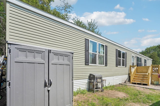 217 Mayfair Rd, Vadnais Heights, MN 55127 - view of side of home featuring a deck