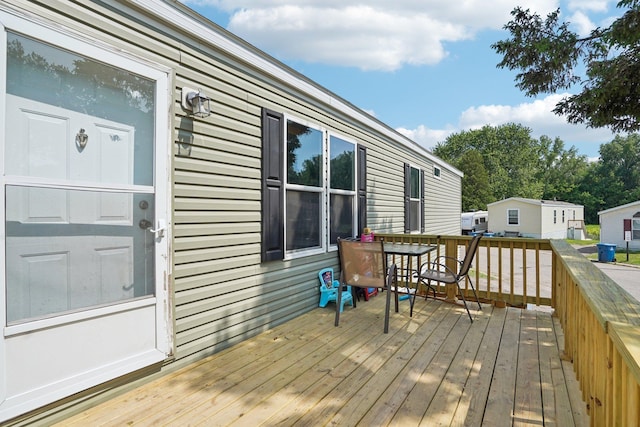 217 Mayfair Rd, Vadnais Heights, MN 55127 - wooden terrace featuring outdoor dining area