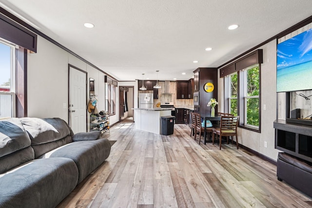 217 Mayfair Rd, Vadnais Heights, MN 55127 - living room featuring light wood-type flooring, recessed lighting, and ornamental molding