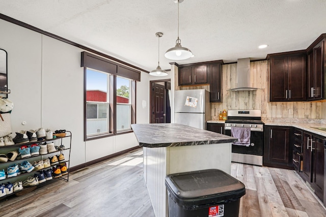 217 Mayfair Rd, Vadnais Heights, MN 55127 - kitchen featuring wall chimney exhaust hood, stainless steel appliances, light wood-type flooring, dark brown cabinets, and ornamental molding