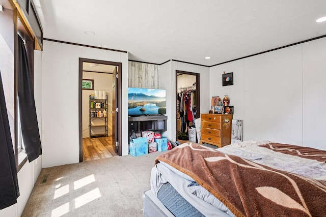 217 Mayfair Rd, Vadnais Heights, MN 55127 - carpeted bedroom with ornamental molding, recessed lighting, a spacious closet, ensuite bath, and a closet