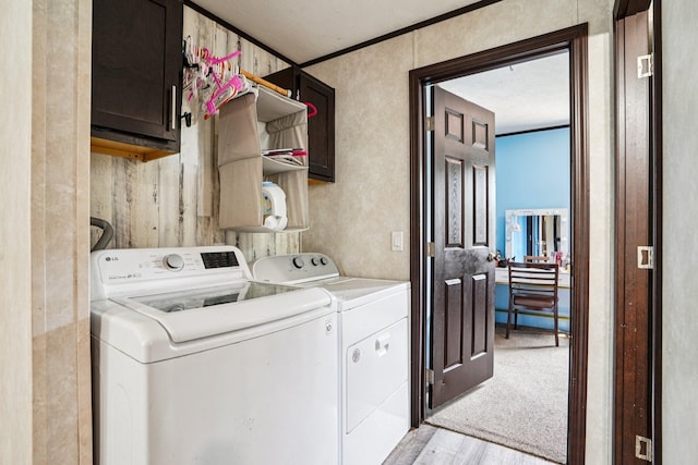 217 Mayfair Rd, Vadnais Heights, MN 55127 - laundry room with cabinet space, washing machine and clothes dryer, and light wood-style floors