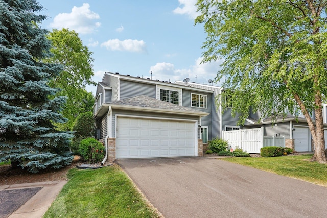 2001 Gresham Ave N, Oakdale, MN 55128 - traditional home featuring driveway and brick siding