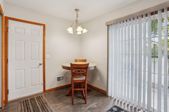 2001 Gresham Ave N, Oakdale, MN 55128 - dining room featuring wood finished floors and a chandelier