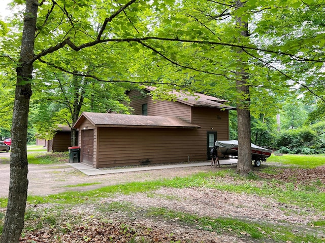 5019/5021 Ojibwa Rd, Brainerd, MN 56401 - view of property exterior with driveway and a detached garage