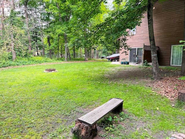 5019/5021 Ojibwa Rd, Brainerd, MN 56401 - view of grassy yard featuring an outdoor fire pit