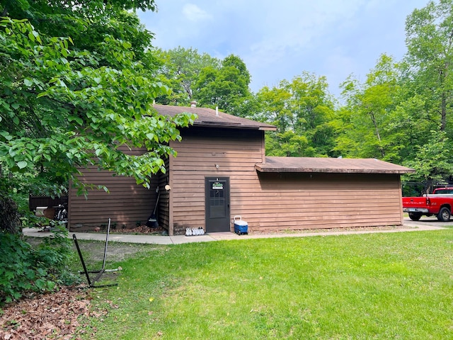 5019/5021 Ojibwa Rd, Brainerd, MN 56401 - back of property with a lawn and roof with shingles