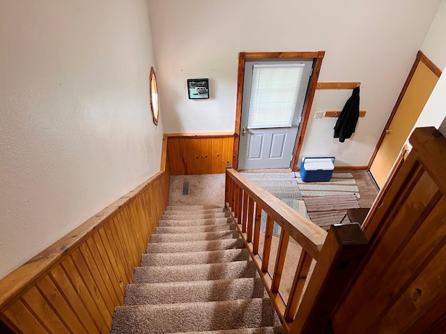 5019/5021 Ojibwa Rd, Brainerd, MN 56401 - staircase with carpet floors and a wainscoted wall