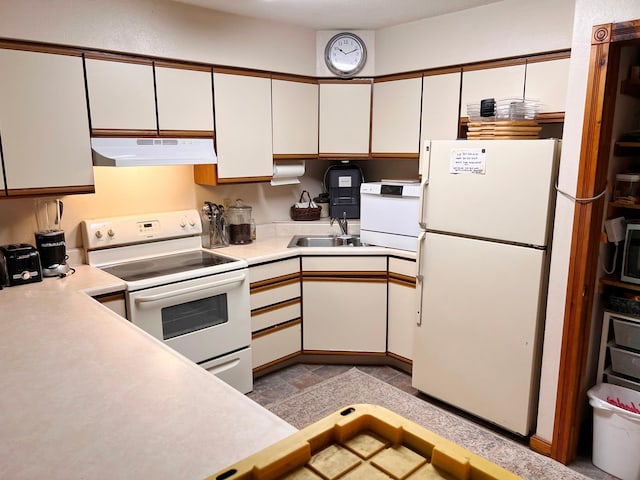 5019/5021 Ojibwa Rd, Brainerd, MN 56401 - kitchen with white appliances, under cabinet range hood, light countertops, and white cabinetry