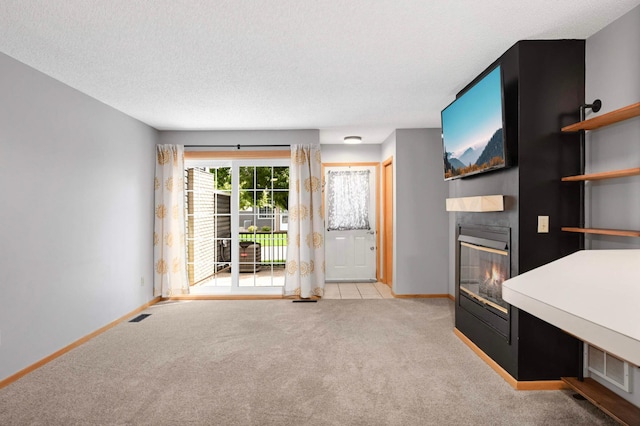 1830 Donegal Dr Unit 11, Woodbury, MN 55125 - unfurnished living room featuring a large fireplace, light carpet, and a textured ceiling