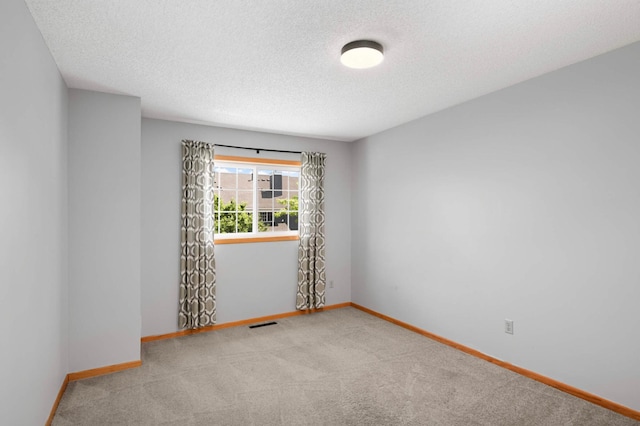 1830 Donegal Dr Unit 11, Woodbury, MN 55125 - carpeted empty room with a textured ceiling