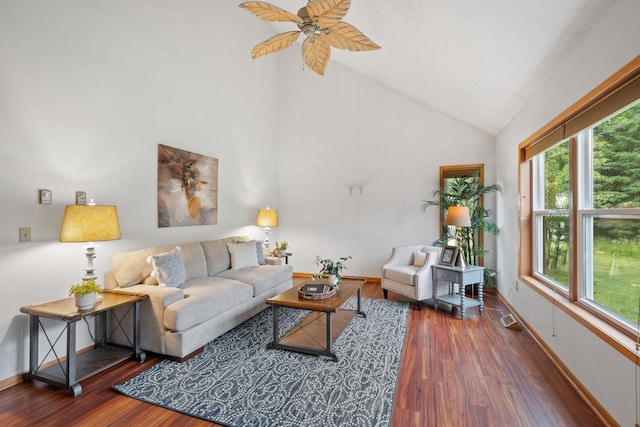 20170 Oxboro Ln N, Scandia, MN 55047 - living area featuring healthy amount of natural light, wood finished floors, a ceiling fan, and high vaulted ceiling
