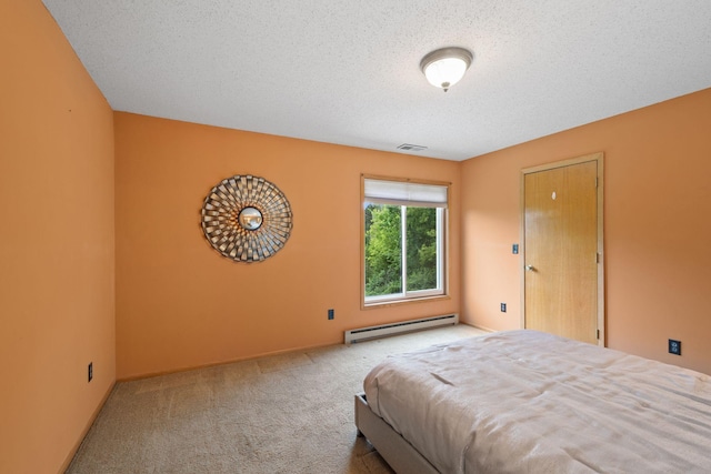 20170 Oxboro Ln N, Scandia, MN 55047 - bedroom with a baseboard radiator, carpet flooring, and a textured ceiling