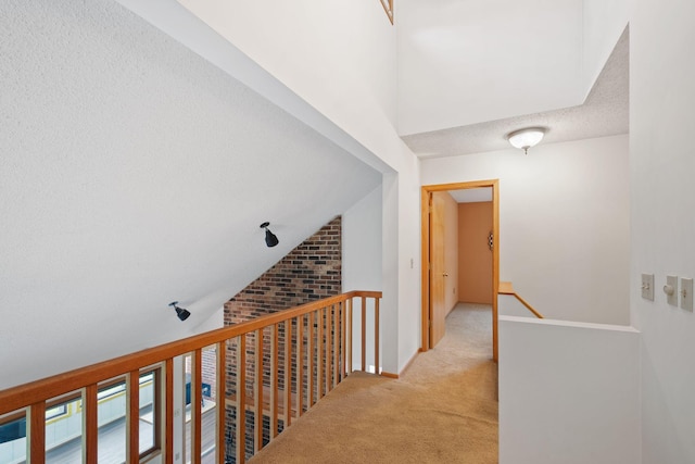 20170 Oxboro Ln N, Scandia, MN 55047 - hall with an upstairs landing, carpet flooring, a textured ceiling, and lofted ceiling