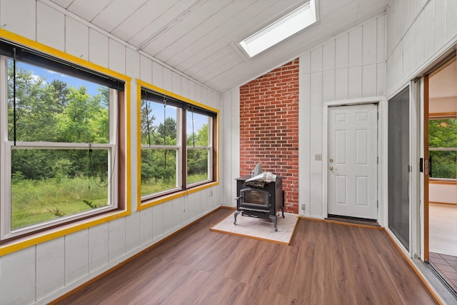 20170 Oxboro Ln N, Scandia, MN 55047 - unfurnished sunroom featuring lofted ceiling, a wood stove, a skylight, and healthy amount of natural light