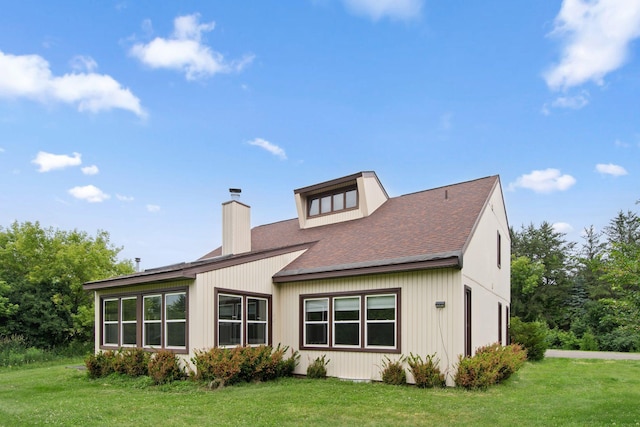 20170 Oxboro Ln N, Scandia, MN 55047 - back of house with a shingled roof, a lawn, and a chimney