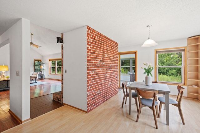 20170 Oxboro Ln N, Scandia, MN 55047 - dining area with wood finished floors, a textured ceiling, and lofted ceiling