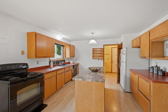 20170 Oxboro Ln N, Scandia, MN 55047 - kitchen featuring black range with electric cooktop, a center island, light wood finished floors, dishwashing machine, and freestanding refrigerator