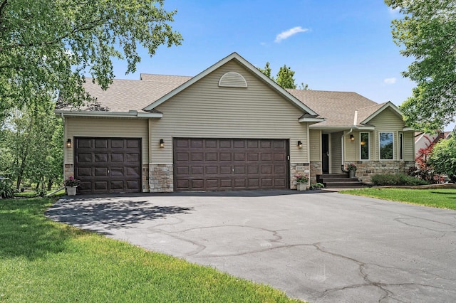 11847 Meadow Curv, Lindstrom, MN 55045 - view of front facade with a garage, stone siding, and asphalt driveway