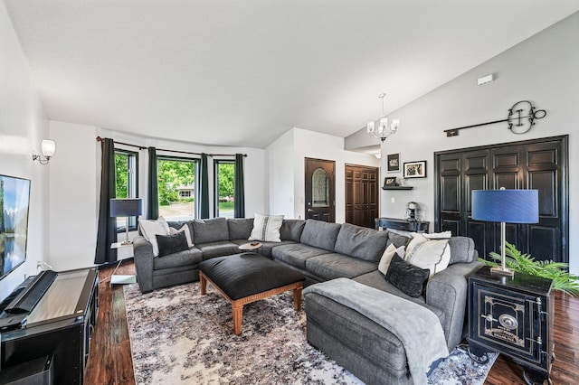 11847 Meadow Curv, Lindstrom, MN 55045 - living area featuring dark wood finished floors, a chandelier, and high vaulted ceiling