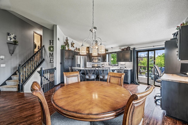 11847 Meadow Curv, Lindstrom, MN 55045 - dining space featuring wood finished floors, a textured ceiling, stairs, and a chandelier