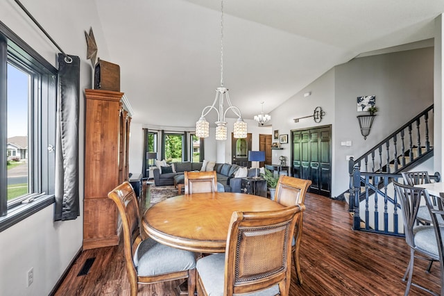 11847 Meadow Curv, Lindstrom, MN 55045 - dining room with dark wood finished floors, a chandelier, stairway, and high vaulted ceiling