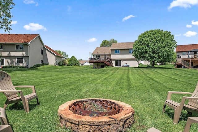11847 Meadow Curv, Lindstrom, MN 55045 - view of grassy yard featuring a fire pit, stairway, and a wooden deck
