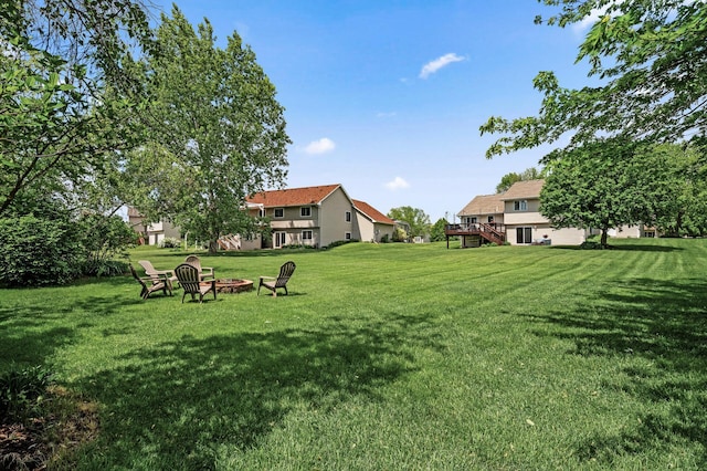 11847 Meadow Curv, Lindstrom, MN 55045 - view of grassy yard with a fire pit and stairs