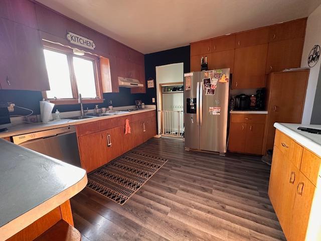 3507 Salo Rd, Waasa Twp, MN 55732 - kitchen featuring stainless steel fridge, dishwashing machine, dark wood-type flooring, under cabinet range hood, and light countertops