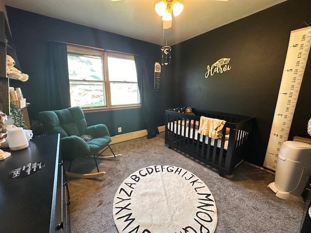 3507 Salo Rd, Waasa Twp, MN 55732 - carpeted bedroom featuring a nursery area and ceiling fan