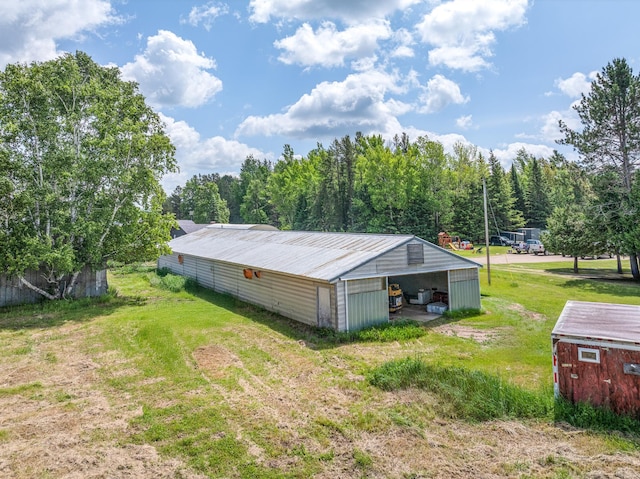 3507 Salo Rd, Waasa Twp, MN 55732 - view of home's exterior with a pole building, an outdoor structure, a yard, and a metal roof