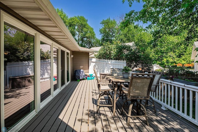 105 5th Ave W, West Fargo, ND 58078 - wooden deck with outdoor dining area and grilling area