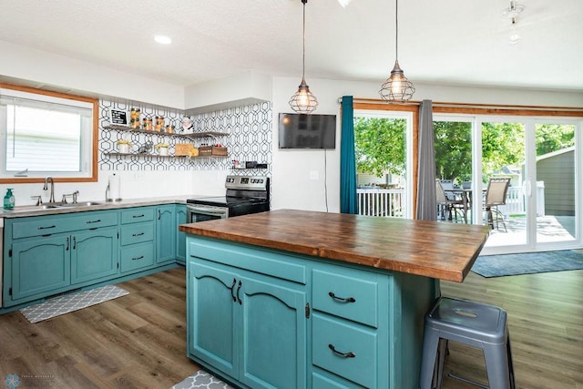 105 5th Ave W, West Fargo, ND 58078 - kitchen featuring stainless steel range with electric stovetop, butcher block countertops, dark wood-style flooring, open shelves, and blue cabinetry