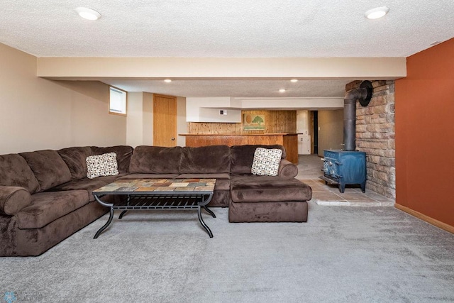 105 5th Ave W, West Fargo, ND 58078 - living room featuring a wood stove, light carpet, and a textured ceiling