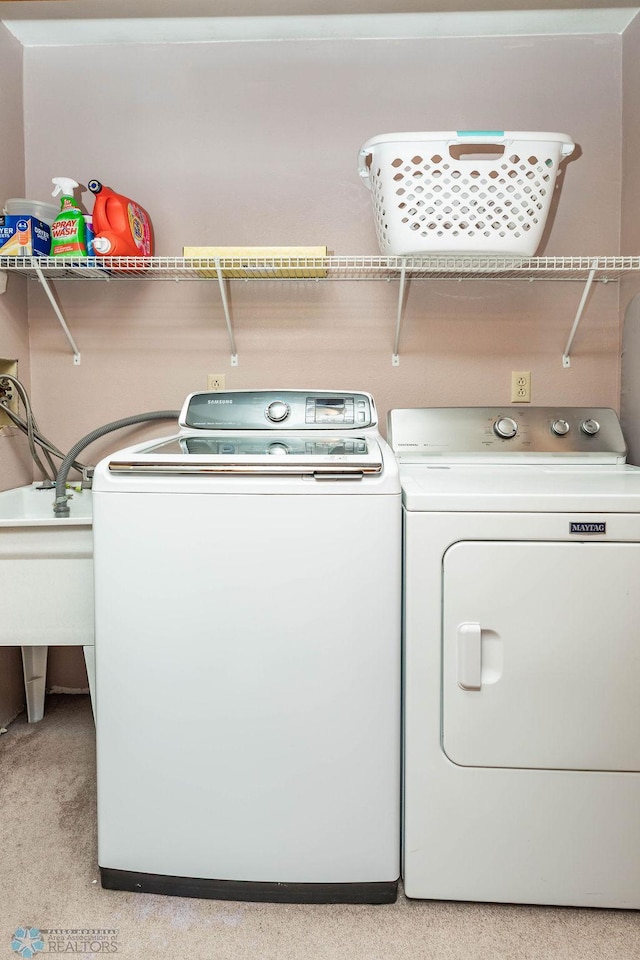 105 5th Ave W, West Fargo, ND 58078 - laundry area featuring washing machine and dryer and light colored carpet