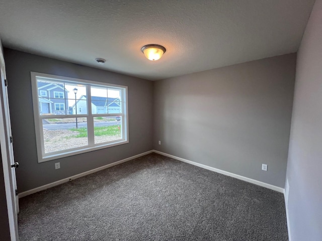 2488 Jacamar Ave NE, Saint Michael, MN 55376 - unfurnished room with dark carpet and baseboards