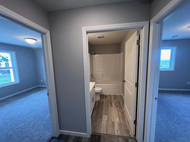 2488 Jacamar Ave NE, Saint Michael, MN 55376 - bathroom with vanity, shower / bathtub combination, and wood finished floors