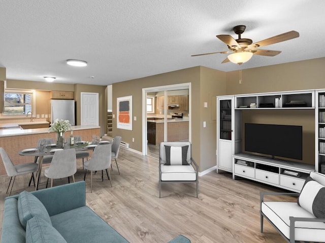 26161 8th St W, Zimmerman, MN 55398 - living room with ceiling fan, light wood finished floors, and a textured ceiling