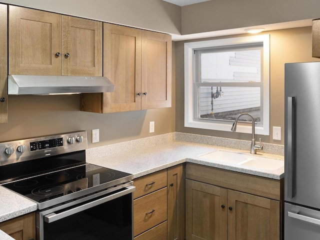 26161 8th St W, Zimmerman, MN 55398 - kitchen featuring appliances with stainless steel finishes, range hood, and light countertops