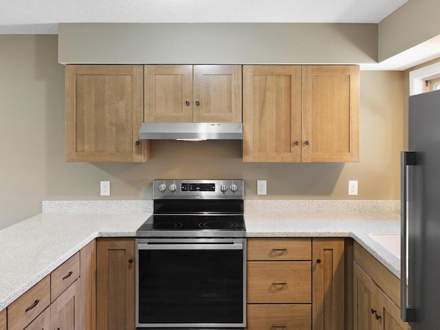 26161 8th St W, Zimmerman, MN 55398 - kitchen featuring appliances with stainless steel finishes, under cabinet range hood, and light countertops