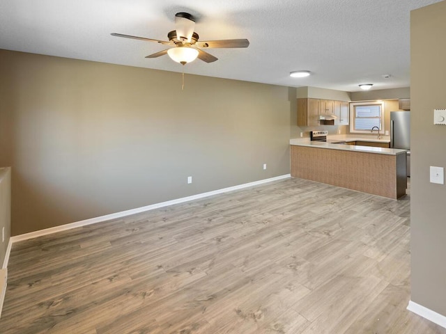 26161 8th St W, Zimmerman, MN 55398 - unfurnished living room with a ceiling fan and light wood-style floors