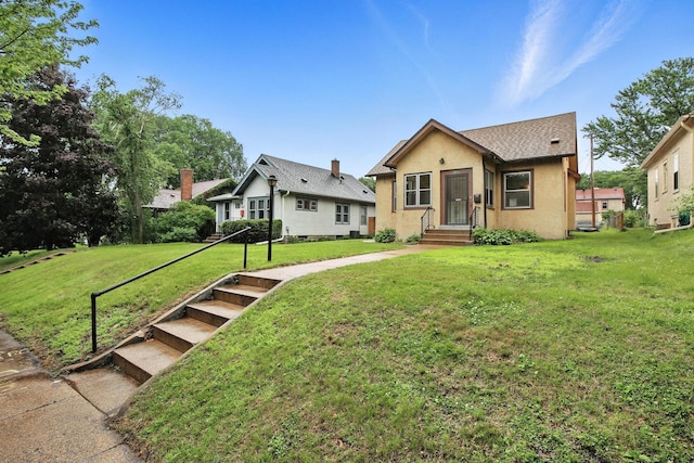 4529 17th Ave S, Minneapolis, MN 55407 - bungalow-style home featuring stucco siding and a front lawn
