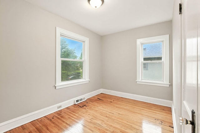 4529 17th Ave S, Minneapolis, MN 55407 - unfurnished room with baseboards and wood finished floors