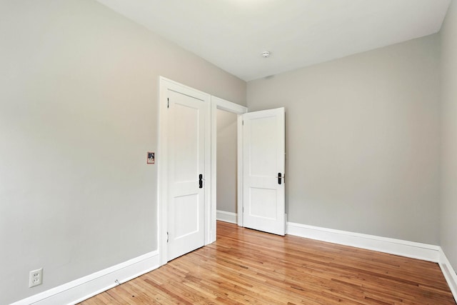 4529 17th Ave S, Minneapolis, MN 55407 - unfurnished bedroom with baseboards and light wood-style floors