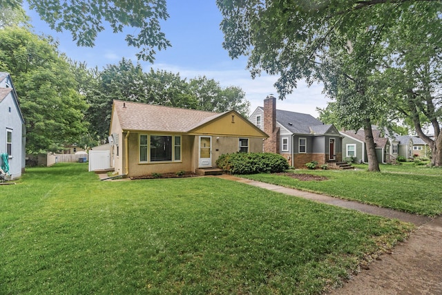 5524 34th Ave S, Minneapolis, MN 55417 - view of front of property featuring a front yard and roof with shingles