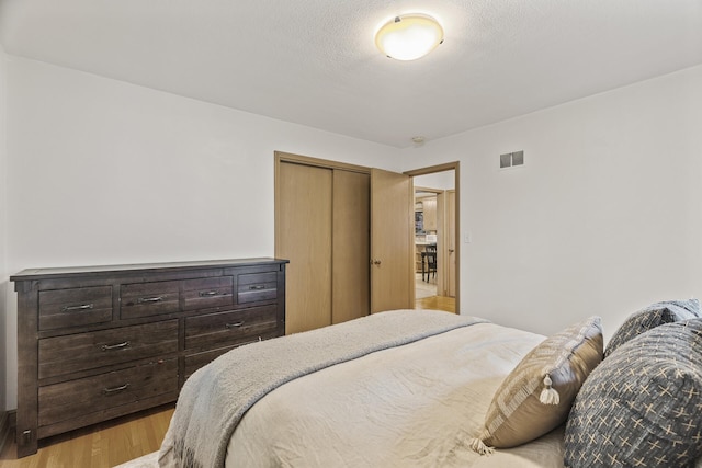 5524 34th Ave S, Minneapolis, MN 55417 - bedroom with light wood-style floors and a closet