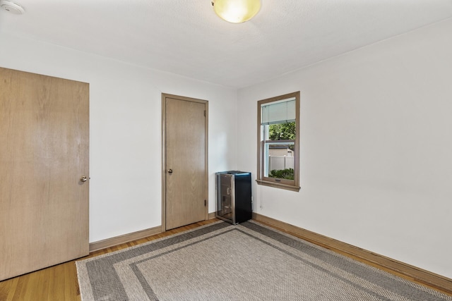 5524 34th Ave S, Minneapolis, MN 55417 - spare room with a smoke detector, light wood-style flooring, and heating unit