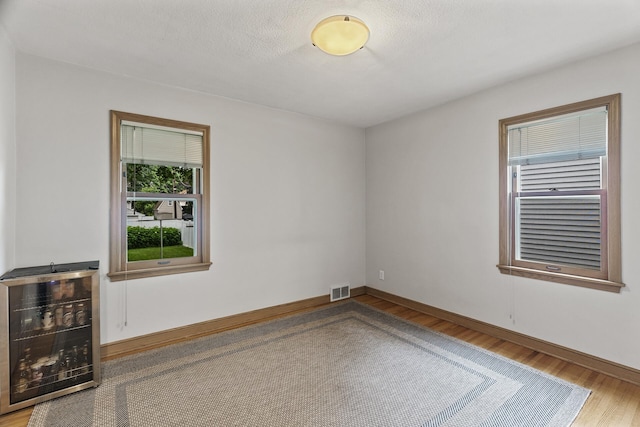 5524 34th Ave S, Minneapolis, MN 55417 - unfurnished room with wood finished floors and baseboards