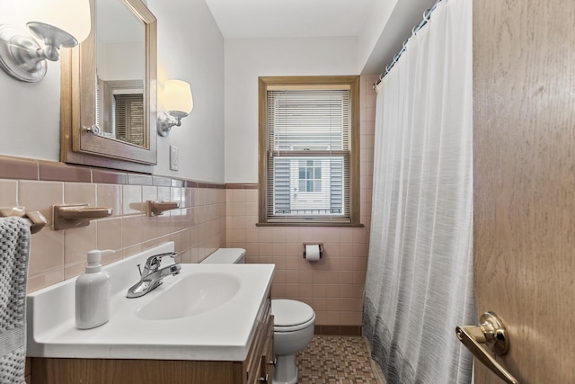 5524 34th Ave S, Minneapolis, MN 55417 - full bathroom featuring vanity, tile walls, wainscoting, and a shower with shower curtain